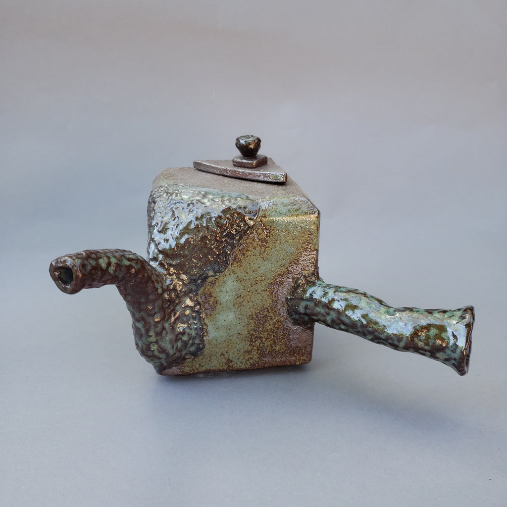 stone wear teapot in cube shape