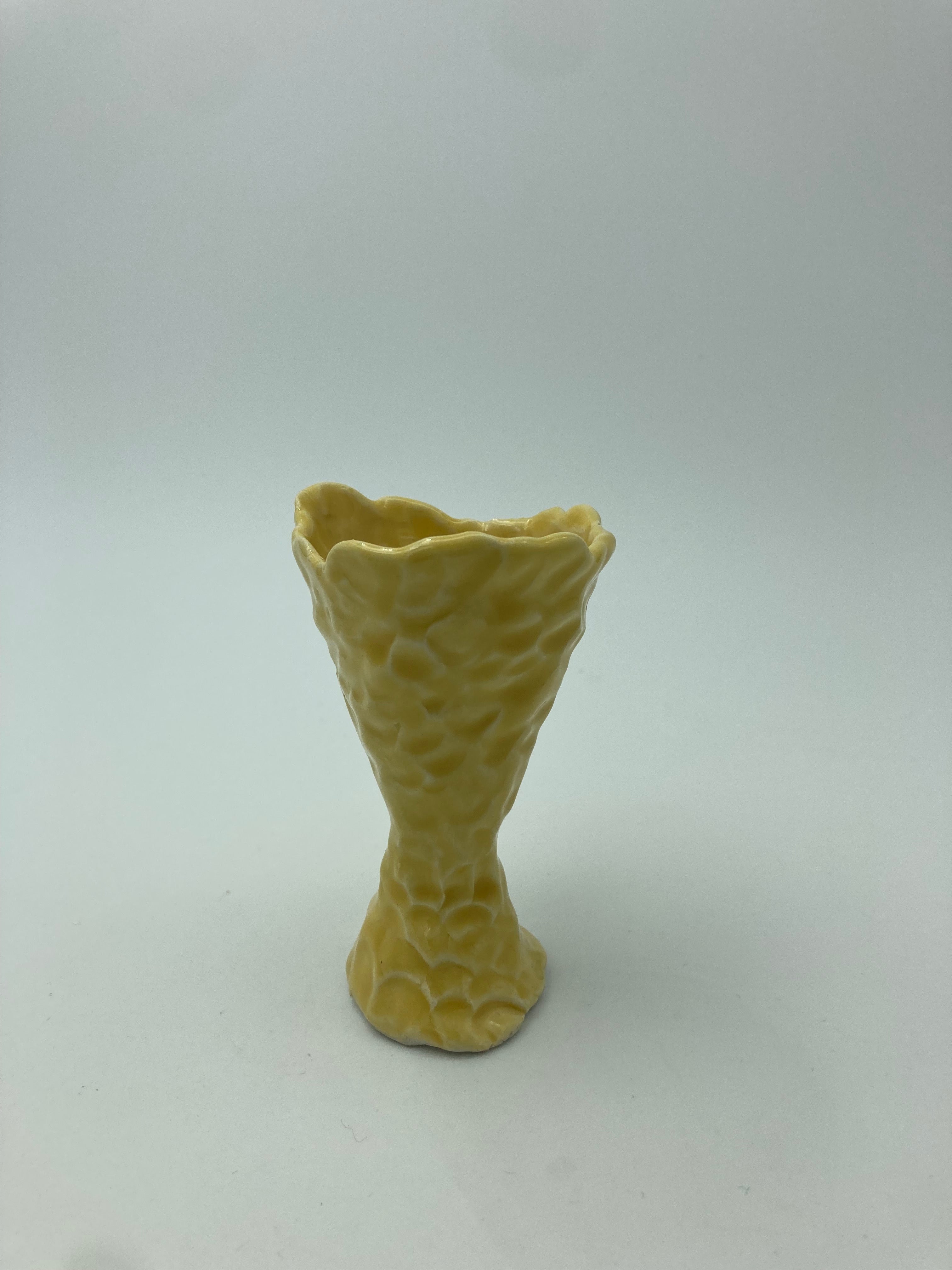 Small yellow decorative object/vase