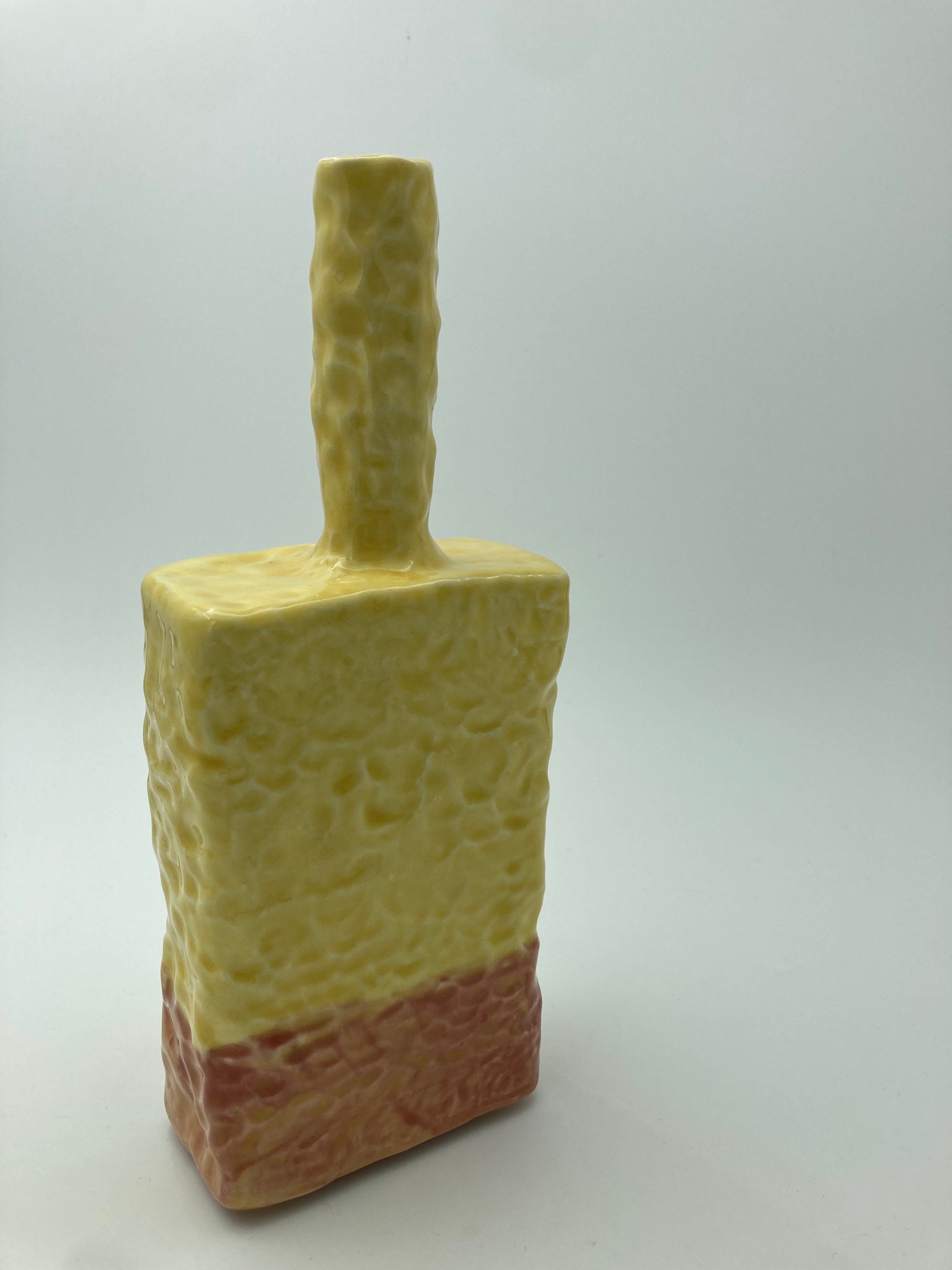 Yellow and red textured bottle